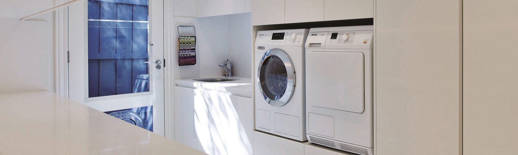 Laundry Cabinets by H&H Cabinets